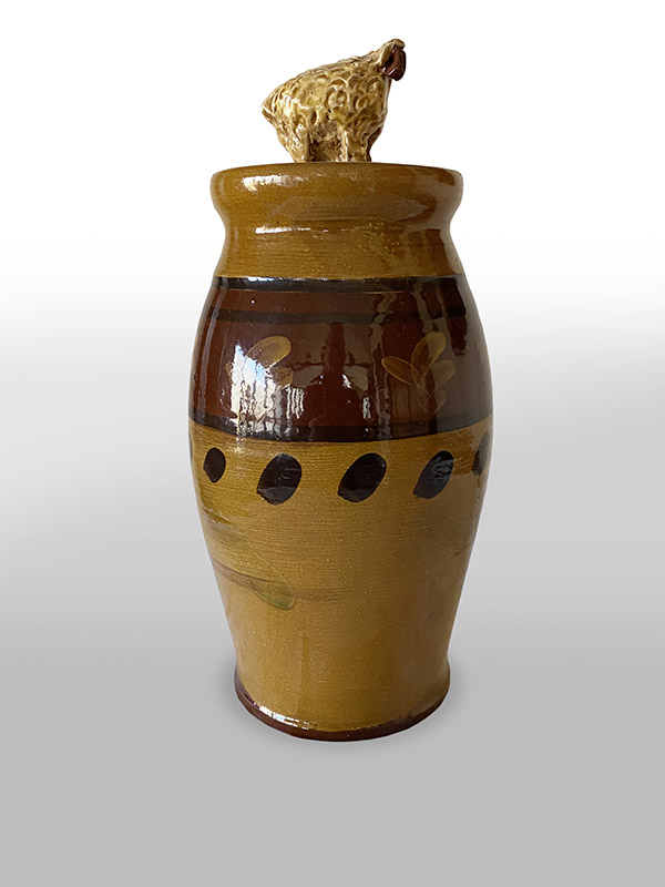 Redware jar with sheep lid